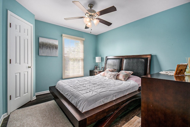 bedroom with ceiling fan and hardwood / wood-style flooring