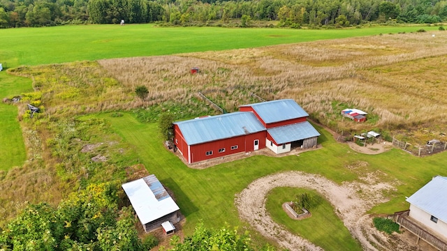 birds eye view of property featuring a rural view