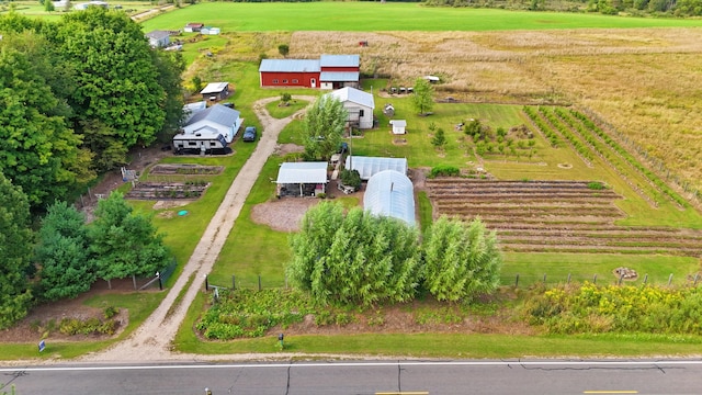 birds eye view of property with a rural view