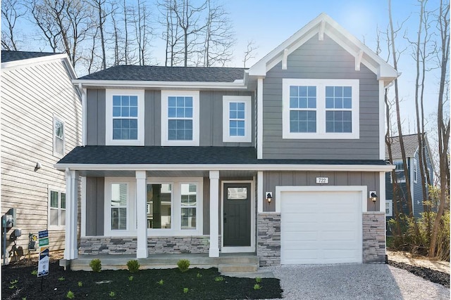 craftsman house featuring a porch and a garage