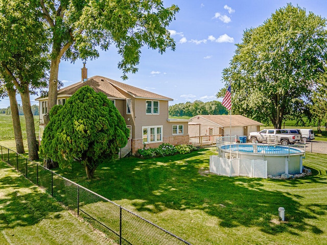 view of yard featuring a fenced in pool