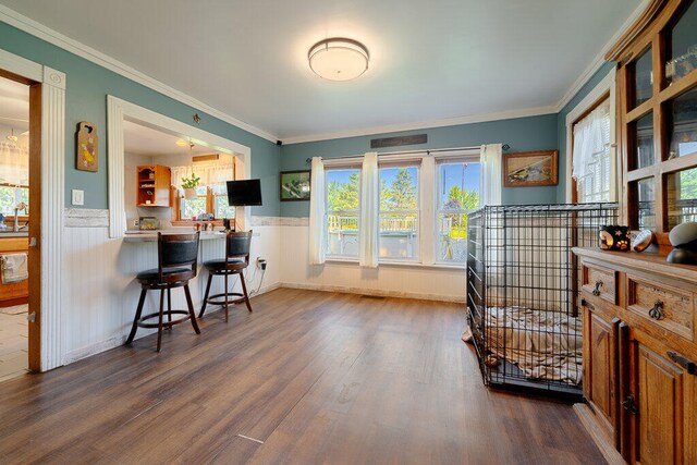 interior space featuring hardwood / wood-style flooring and ornamental molding