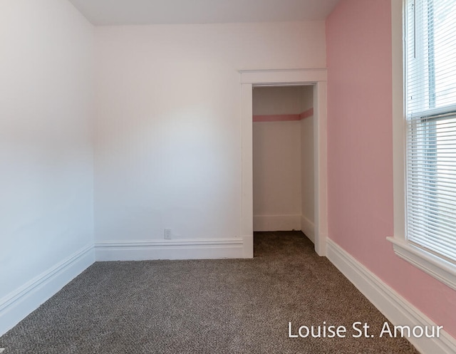 unfurnished bedroom with a closet and carpet floors