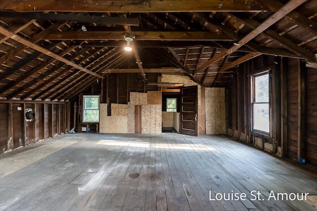unfinished attic with a healthy amount of sunlight