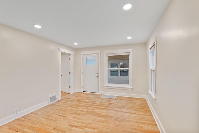 spare room with light wood-type flooring