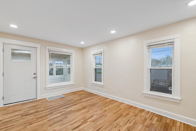 foyer with light hardwood / wood-style floors