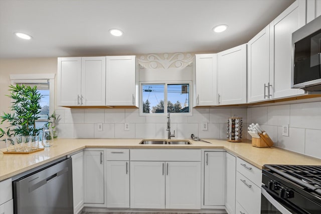 kitchen with backsplash, a healthy amount of sunlight, and stainless steel appliances