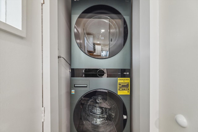 laundry room with stacked washer / dryer