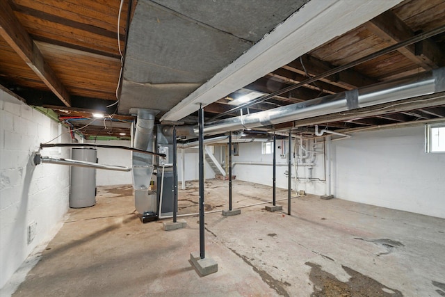 basement with water heater and heating unit