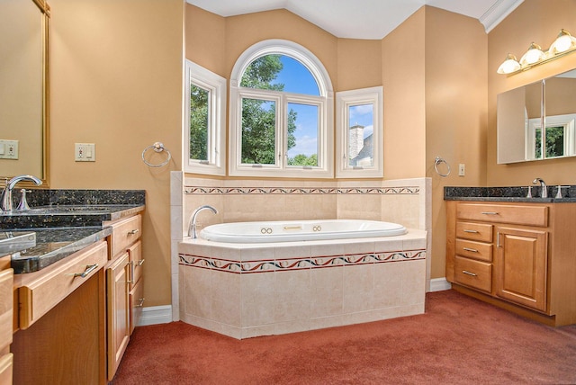 bathroom featuring lofted ceiling, vanity, and a bath