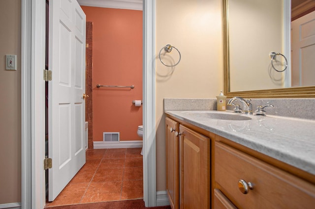 bathroom with baseboards, visible vents, toilet, tile patterned floors, and vanity