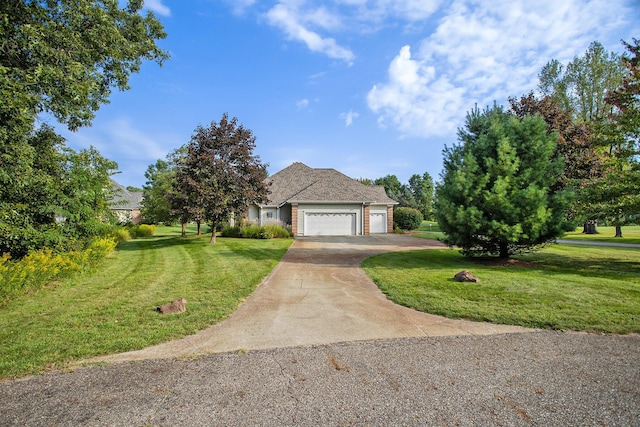 view of front of property featuring a garage, driveway, brick siding, and a front yard