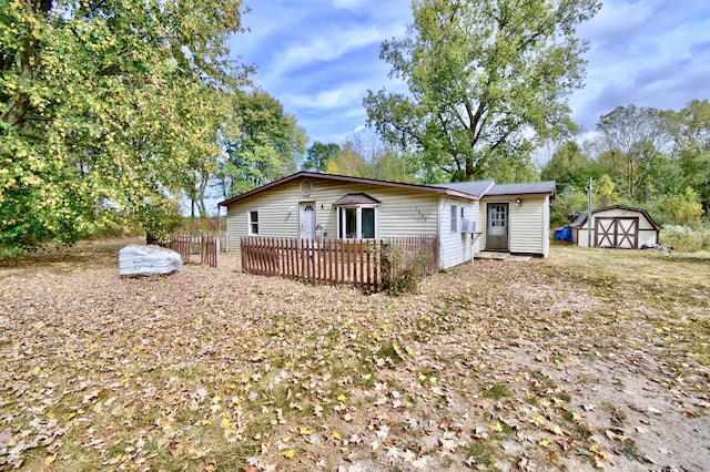 view of front facade with a storage shed