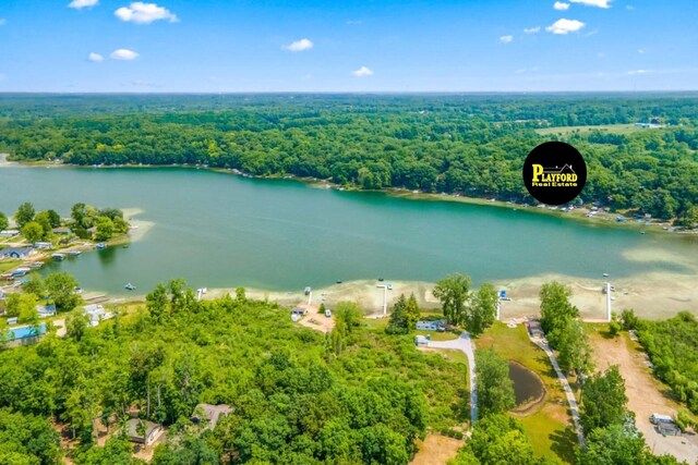 drone / aerial view with a water view and a wooded view