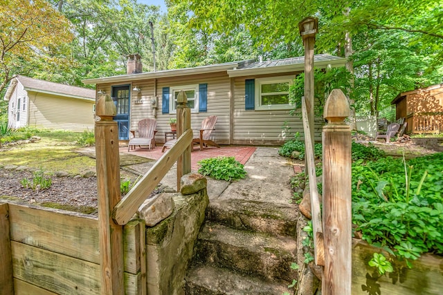 view of front of property featuring a chimney