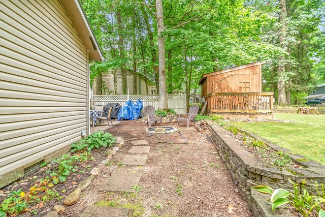 view of yard featuring a wooden deck