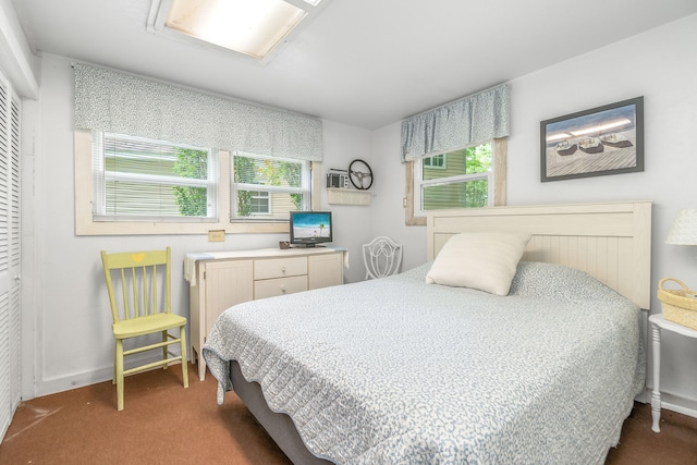 bedroom featuring a closet and dark carpet