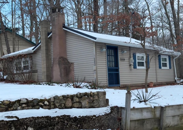 view of front of home featuring a chimney