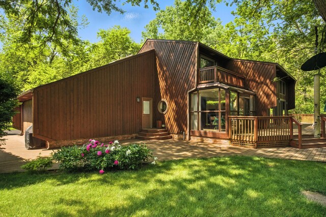 6710 Curtis Rd, Plymouth, MI 48170 - rear view of property featuring a balcony, a yard, and a wooden deck