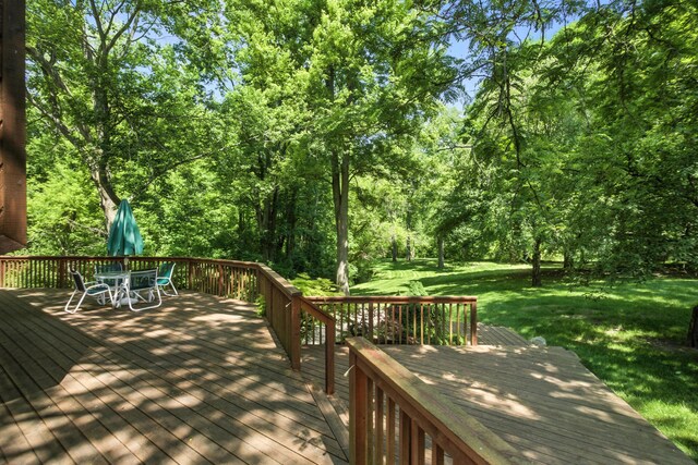 6710 Curtis Rd, Plymouth, MI 48170 - deck featuring outdoor dining area and a lawn