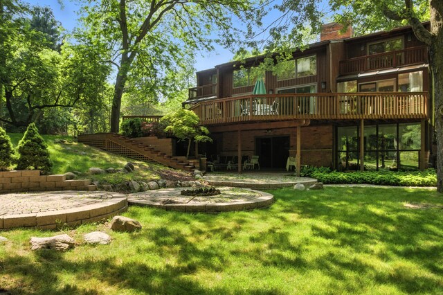 6710 Curtis Rd, Plymouth, MI 48170 - rear view of house featuring stairway, a yard, a chimney, a patio area, and a deck