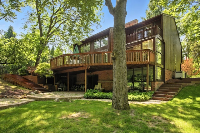 6710 Curtis Rd, Plymouth, MI 48170 - back of house with stairway, a wooden deck, and a lawn