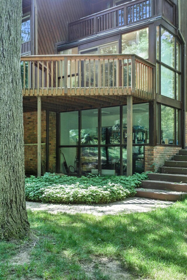 6710 Curtis Rd, Plymouth, MI 48170 - doorway to property with a deck and brick siding