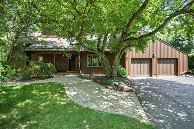 6710 Curtis Rd, Plymouth, MI 48170 - view of front of house featuring driveway and a garage