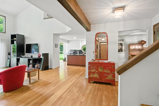 6710 Curtis Rd, Plymouth, MI 48170 - foyer with light wood-type flooring and a textured ceiling