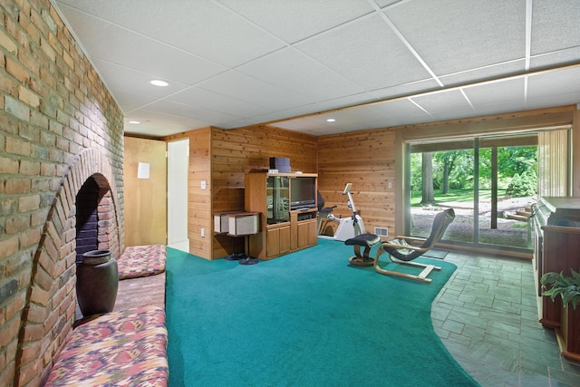 6710 Curtis Rd, Plymouth, MI 48170 - workout room featuring wooden walls, recessed lighting, and a drop ceiling