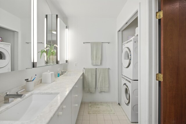 6710 Curtis Rd, Plymouth, MI 48170 - bathroom featuring stacked washer / dryer, tile patterned flooring, and double vanity