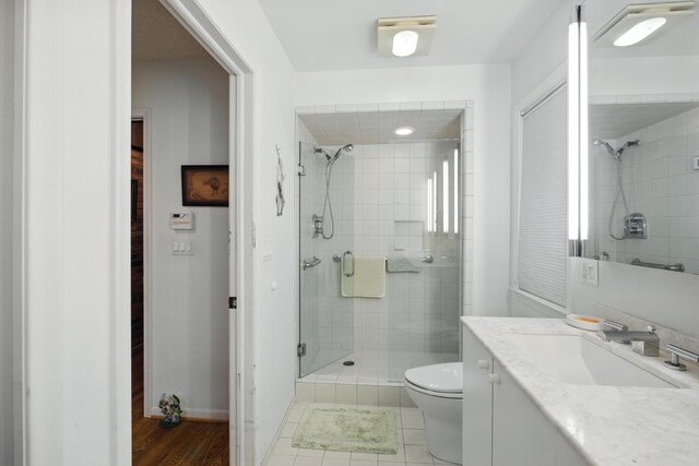 6710 Curtis Rd, Plymouth, MI 48170 - bathroom with a shower stall, vanity, and wood finished floors