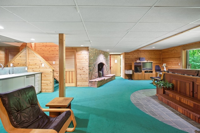 6710 Curtis Rd, Plymouth, MI 48170 - carpeted living area featuring wood walls, a paneled ceiling, and recessed lighting