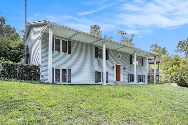 raised ranch featuring a front yard