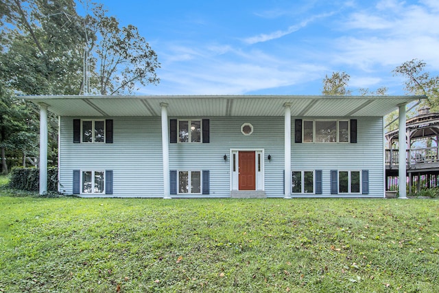 raised ranch with a front yard