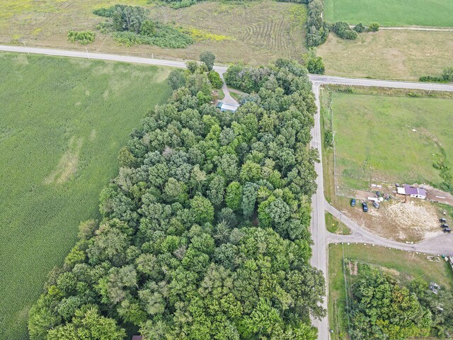 birds eye view of property with a rural view