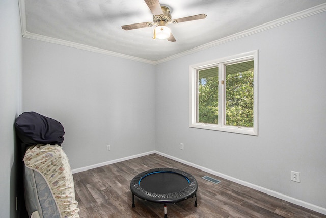 living area featuring ceiling fan, ornamental molding, and dark hardwood / wood-style floors