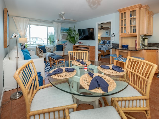 dining space featuring cooling unit, ceiling fan, and tile patterned floors