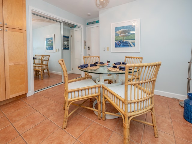 dining room featuring light tile patterned flooring