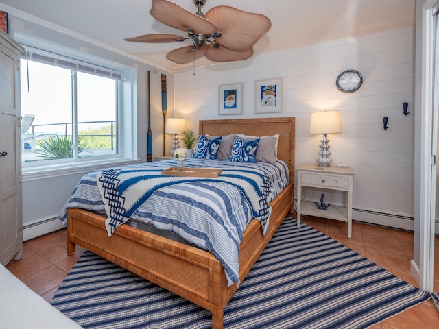 bedroom with crown molding, baseboard heating, light tile patterned floors, and ceiling fan