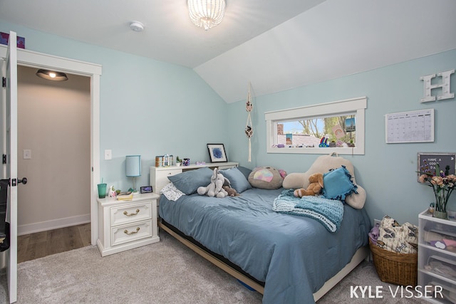 bedroom featuring lofted ceiling