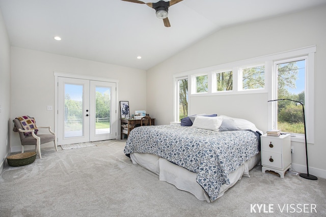 bedroom with light carpet, access to outside, multiple windows, and lofted ceiling