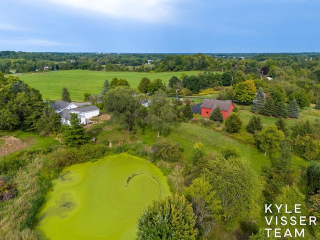 birds eye view of property with a rural view