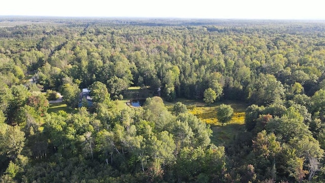 aerial view featuring a wooded view