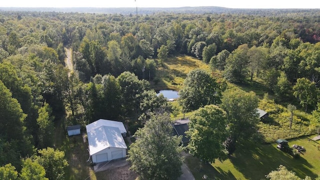 birds eye view of property with a wooded view