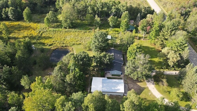 birds eye view of property with a wooded view