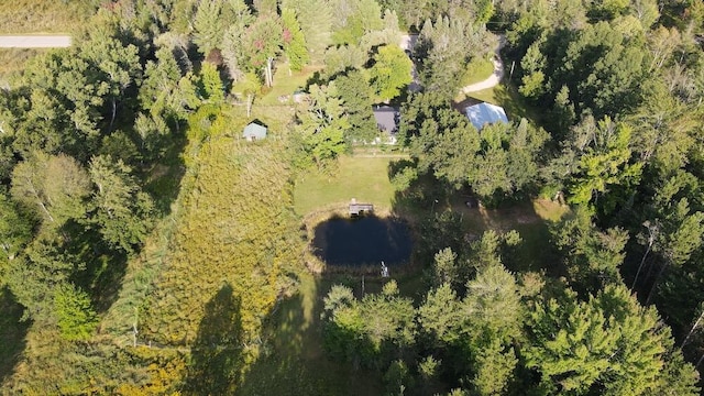 bird's eye view featuring a forest view