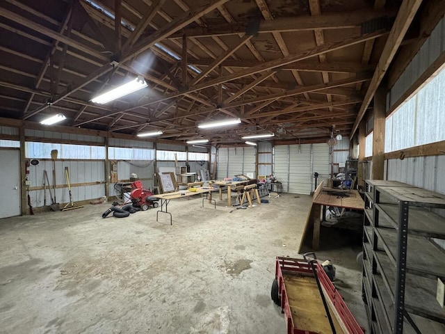 garage featuring metal wall and a workshop area