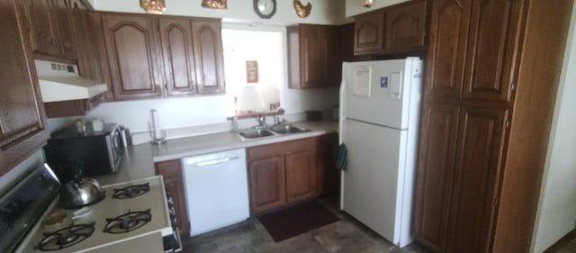 kitchen with sink and white appliances