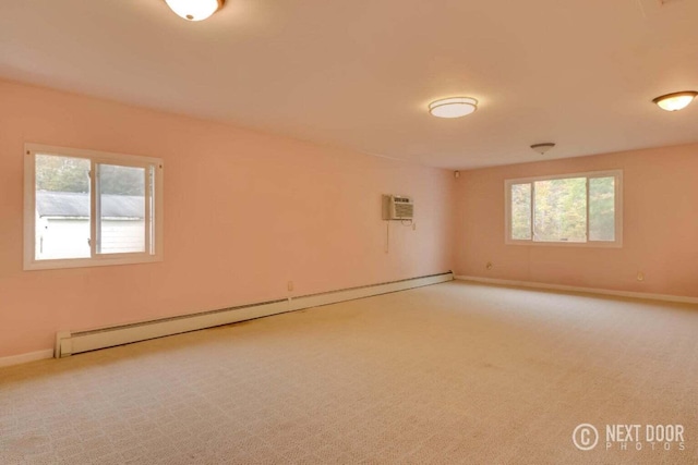 unfurnished room with carpet flooring, baseboard heating, and a wall unit AC